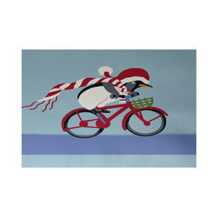Pedaling Penguin Decorative Holiday Print Indoor/Outdoor Area Rug