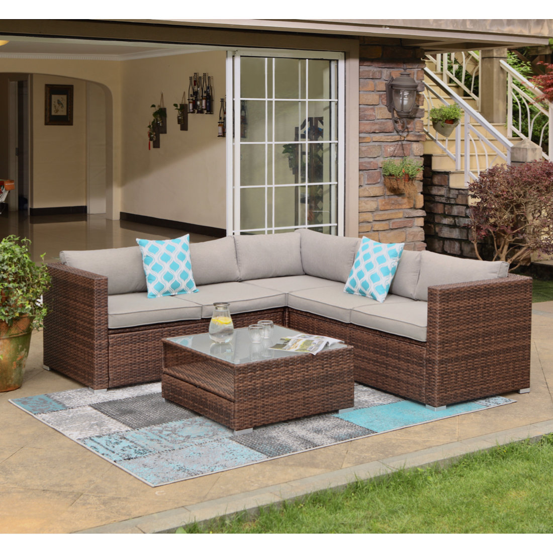 Wrought Studio Newagen 4 Piece Outdoor Furniture Set Mottlewood Brown Wicker Sofa W Warm Gray Cushions Glass Coffee Table 2 Teal Pillows Incl Waterproof Cover Reviews Wayfair