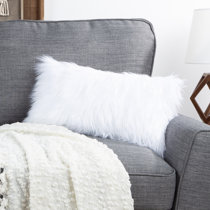 white fluffy throw pillow