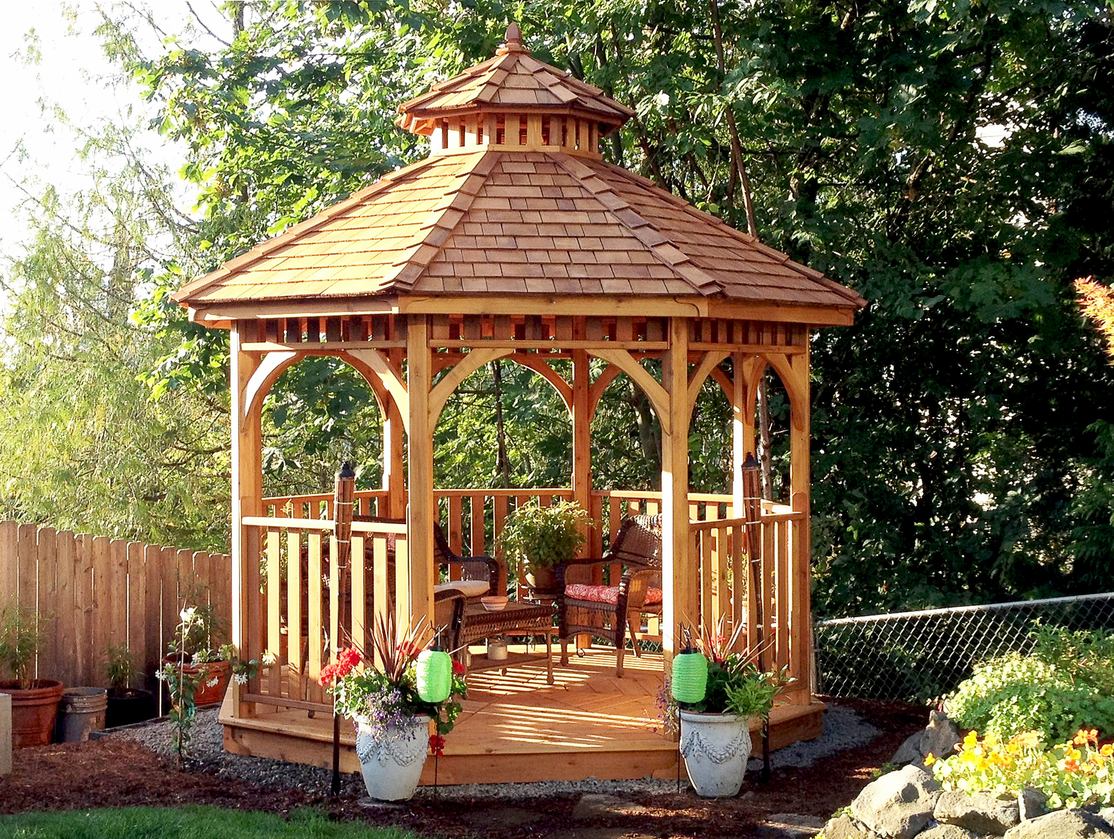 bright wood gazebo in a shaded backyard