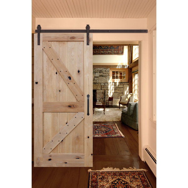 Rustic Knotty Alder Unfinished K Strap Solid Panelled Wood Interior Barn Door by Creative Entryways