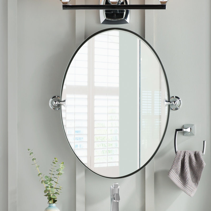 This oval-shaped mirror features a contemporary design.