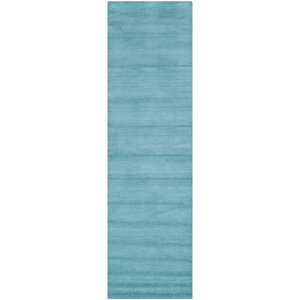 Trost Turquoise Area Rug