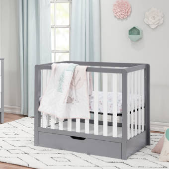 mini crib with storage underneath