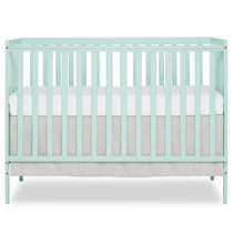 green mini crib