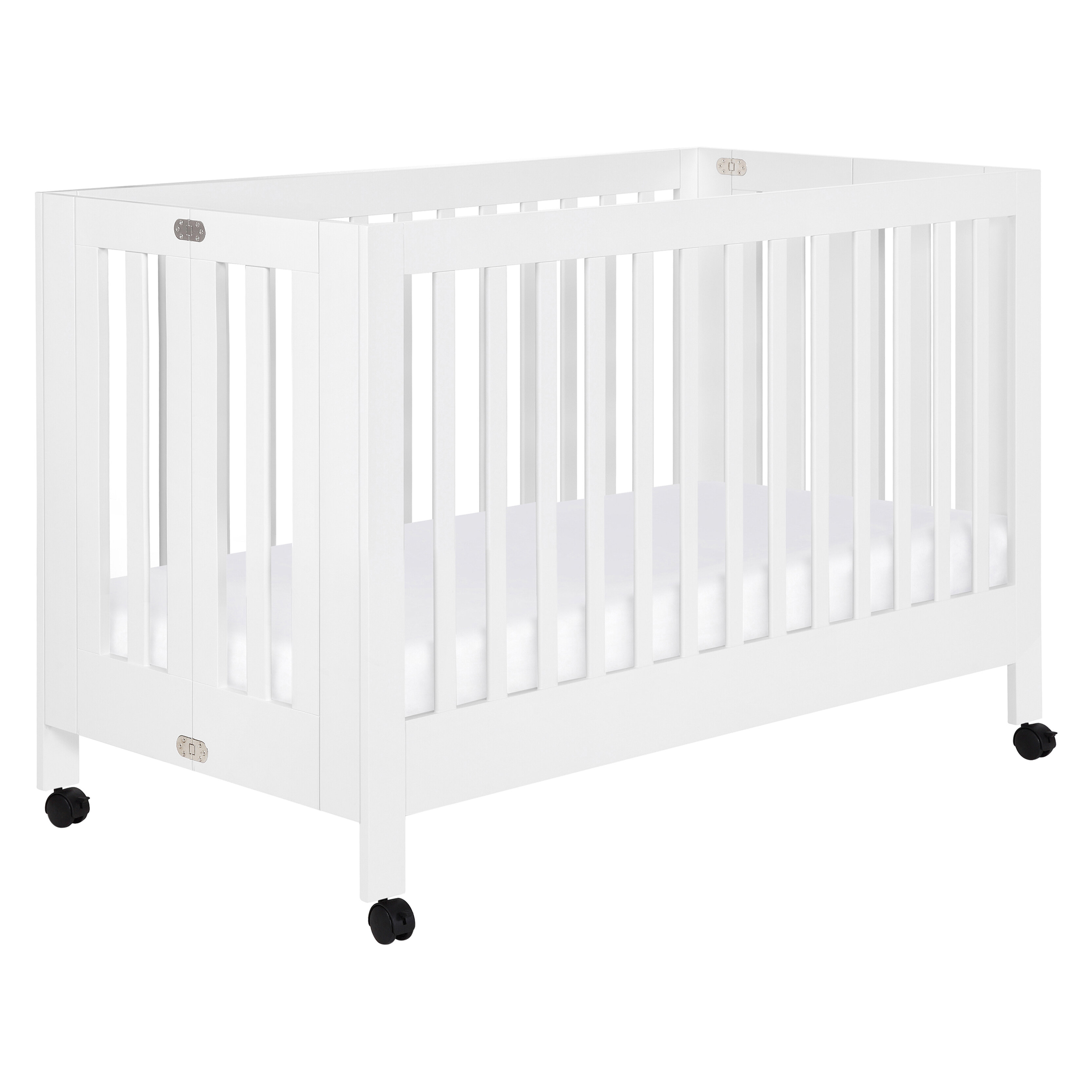 white portable crib