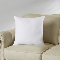 white decorative bed pillows