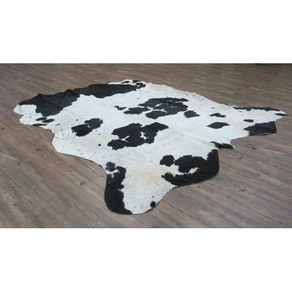 Valora Hand-Woven Cowhide Black/Off-White Area Rug by Loon Peak