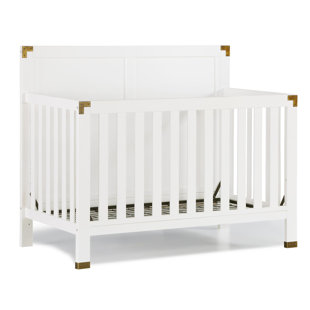white crib with wood legs