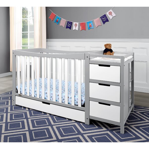 grey crib with changing table