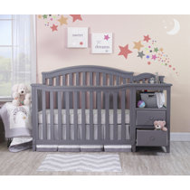 gray crib and changing table