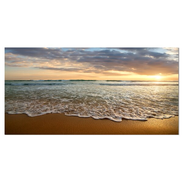 Bright Cloudy Sunset in Calm Ocean Photographic Print on Wrapped Canvas by Design Art