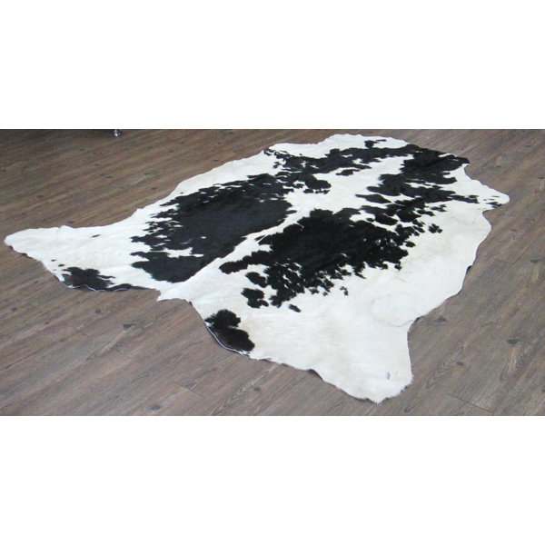 Wakefield Hand-Woven Cowhide Black/White Area Rug by Loon Peak