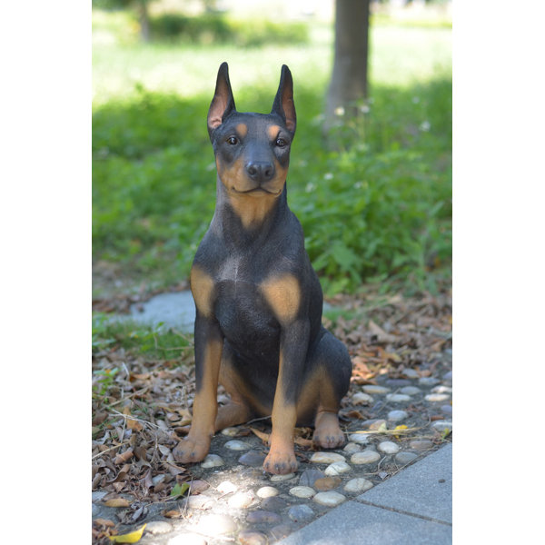 sitting doberman statue