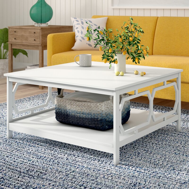 A white two-tiered coffee table is also a smart craft storage solution. It creates additional organization space and an area to relax and plan your next craft project. 
