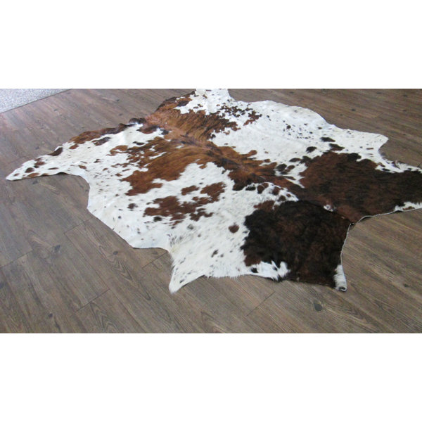 Whitman Hand-Woven Cowhide Brown/White Area Rug by Loon Peak