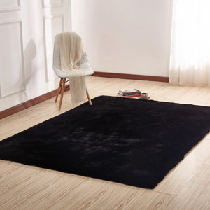 Korman Plush Rabbit Skin Black Area Rug