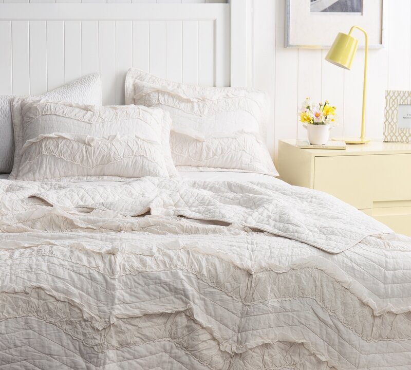 Gabriel Chevron Ruffles Quilt is a gorgeous and not too feminine choice for a shabby chic or modern rustic bedroom. #bedroomdecor #quilts #bedding #whitequilt #rufflequilt #chevron