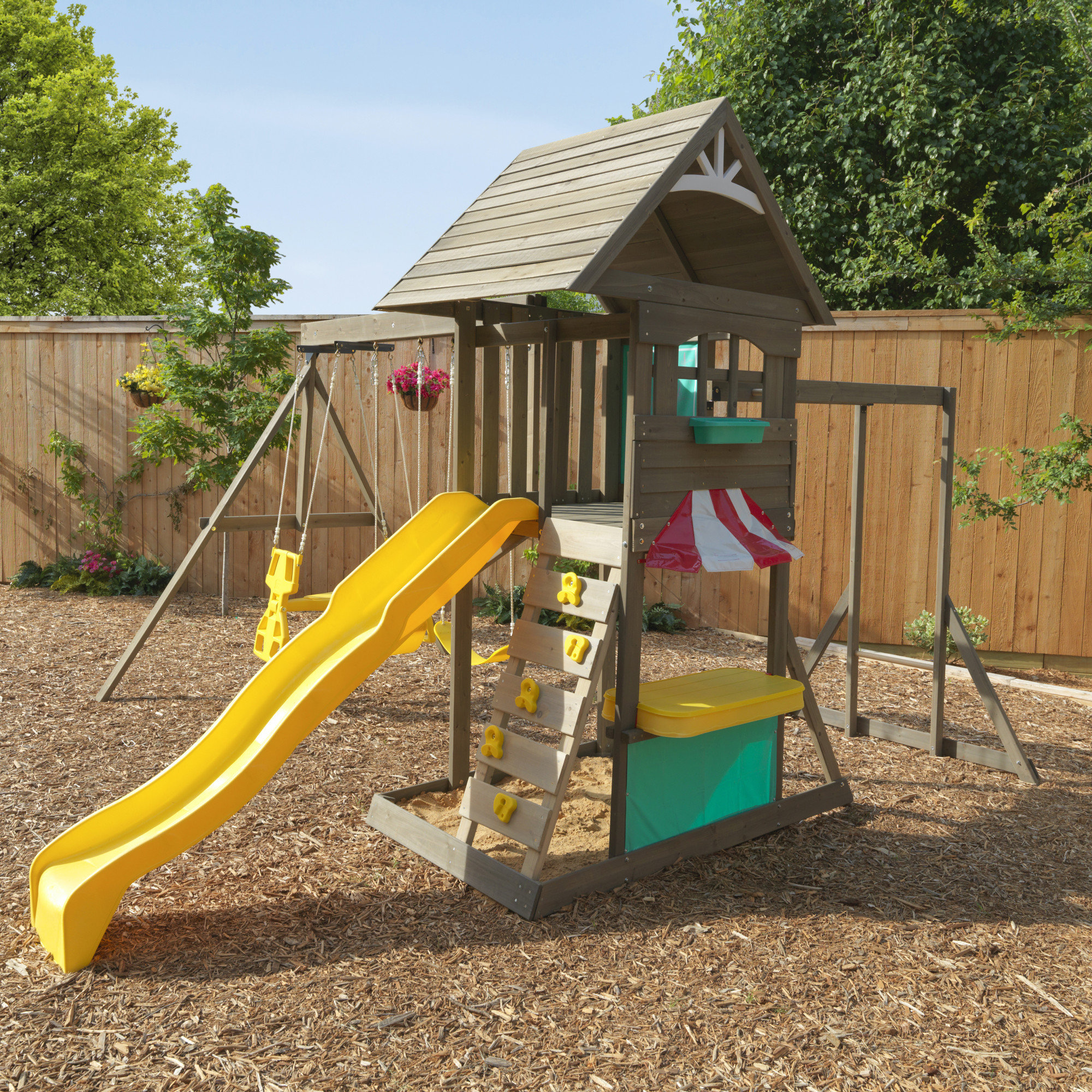 outdoor playhouse with swing