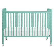 green mini crib