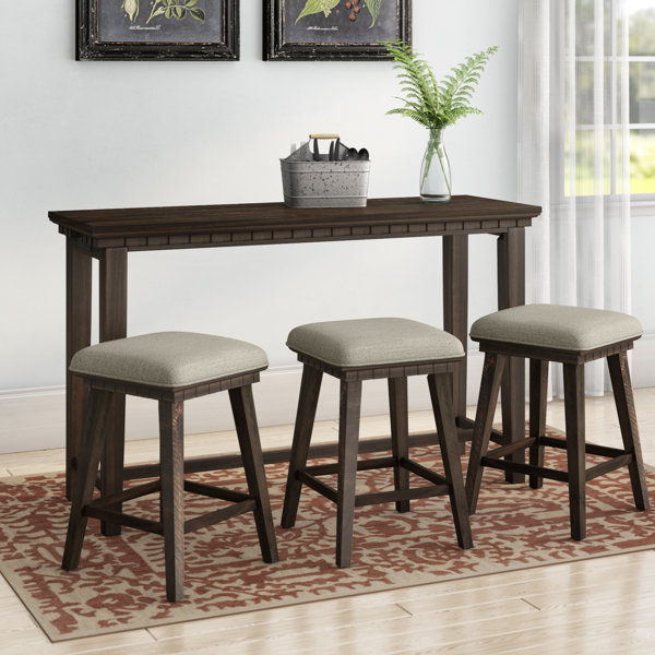 table behind couch with stools