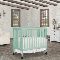 green mini crib