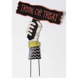 Hand Holding Trick Or Treat Sign