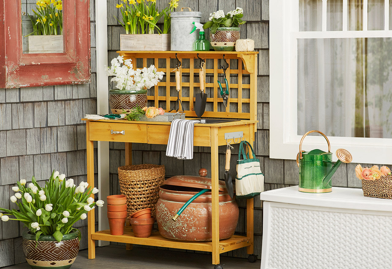 potting table with pots and potting tools